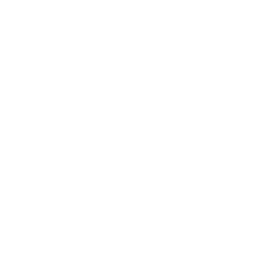A person wearing safety gear uses a chainsaw to cut a large branch from a tall tree, secured with ropes, performing professional tree trimming as part of Kokua Tree Care services for expert tree care Maui.